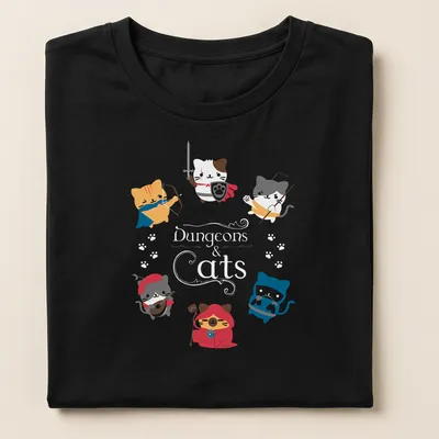 Kawaii design featuring cute cats in fantasy roles with colorful text — printed on a women's shirt