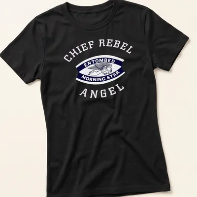 Vintage badge design of an angel with the text 'ENTOMBED MORNING STAR' in navy, white, and pink — printed on a women's shirt