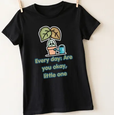 Kawaii cartoon t-shirt with sad potted plant illustration and text — printed on a women's shirt