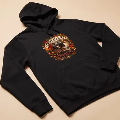 Detailed illustration of autumn leaves, a camera, and a coffee mug around the phrase Every Season tells a Story — printed on a unisex hoodie