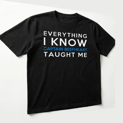 Bold typography shirt featuring Captain Beefheart with blue and white text on black — printed on a unisex t-shirt (angled view)