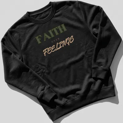 Bold vintage print of 'FAITH over FEELINGS' in green, brown, and tan typography — printed on a unisex sweatshirt
