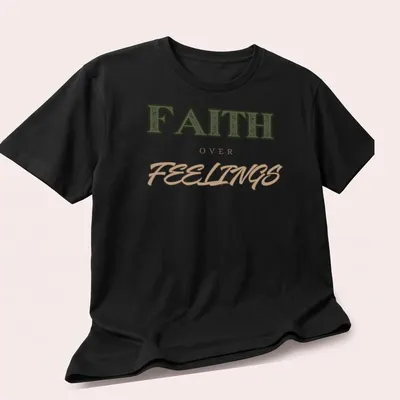 Bold vintage print of 'FAITH over FEELINGS' in green, brown, and tan typography — printed on a unisex t-shirt (angled view)