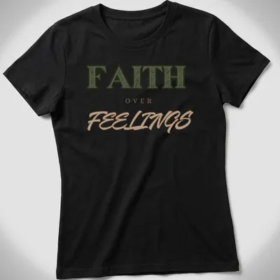 Bold vintage print of 'FAITH over FEELINGS' in green, brown, and tan typography — printed on a women's shirt