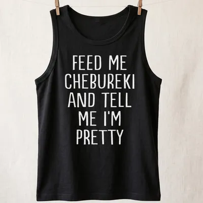Bold white text stating Feed Me Chebureki And Tell Me I'm Pretty on — printed on a tank top