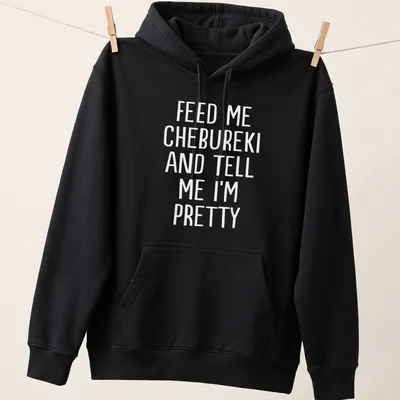 Bold white text stating Feed Me Chebureki And Tell Me I'm Pretty on — printed on a unisex hoodie