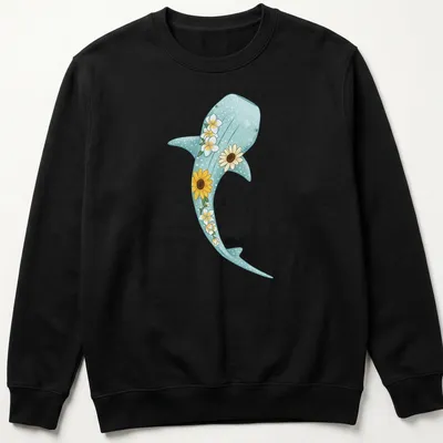 Kawaii illustration of a whale shark surrounded by sunflowers and plumerias in light blue and yellow — printed on a unisex sweatshirt