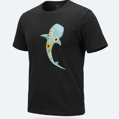 Kawaii illustration of a whale shark surrounded by sunflowers and plumerias in light blue and yellow — printed on a unisex t-shirt