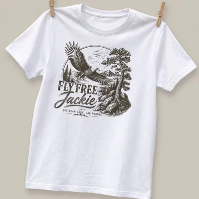 Vintage eagle graphic with text reading 'FLY FREE, Jackie BIG BEAR LAKE, CALIFORNIA' in black, white, and gray