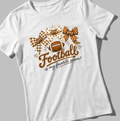 Whimsical design of footballs and bows with the text 'Football is my favorite season' — printed on a women's shirt