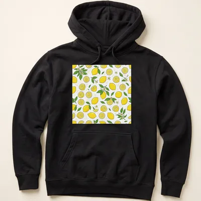 Pattern of bright yellow lemons with green leaves on a white background — printed on a unisex hoodie