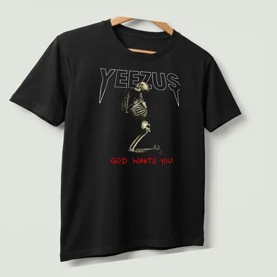 Realistic skeleton illustration with the text 'GOD WANTS YOU' in gold and red — printed on a unisex t-shirt (angled view)
