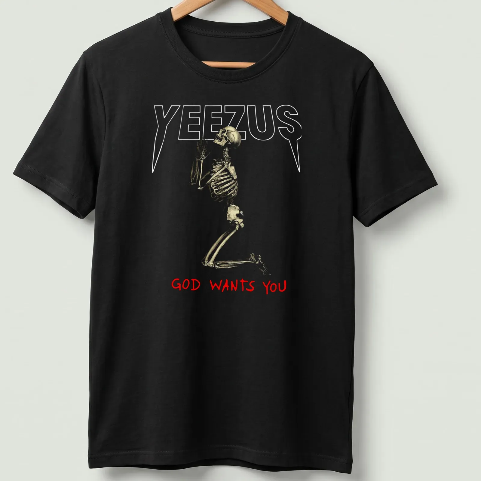 Realistic skeleton illustration with the text 'GOD WANTS YOU' in gold and red — printed on a unisex t-shirt