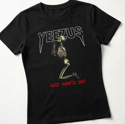 Realistic skeleton illustration with the text 'GOD WANTS YOU' in gold and red — printed on a women's shirt