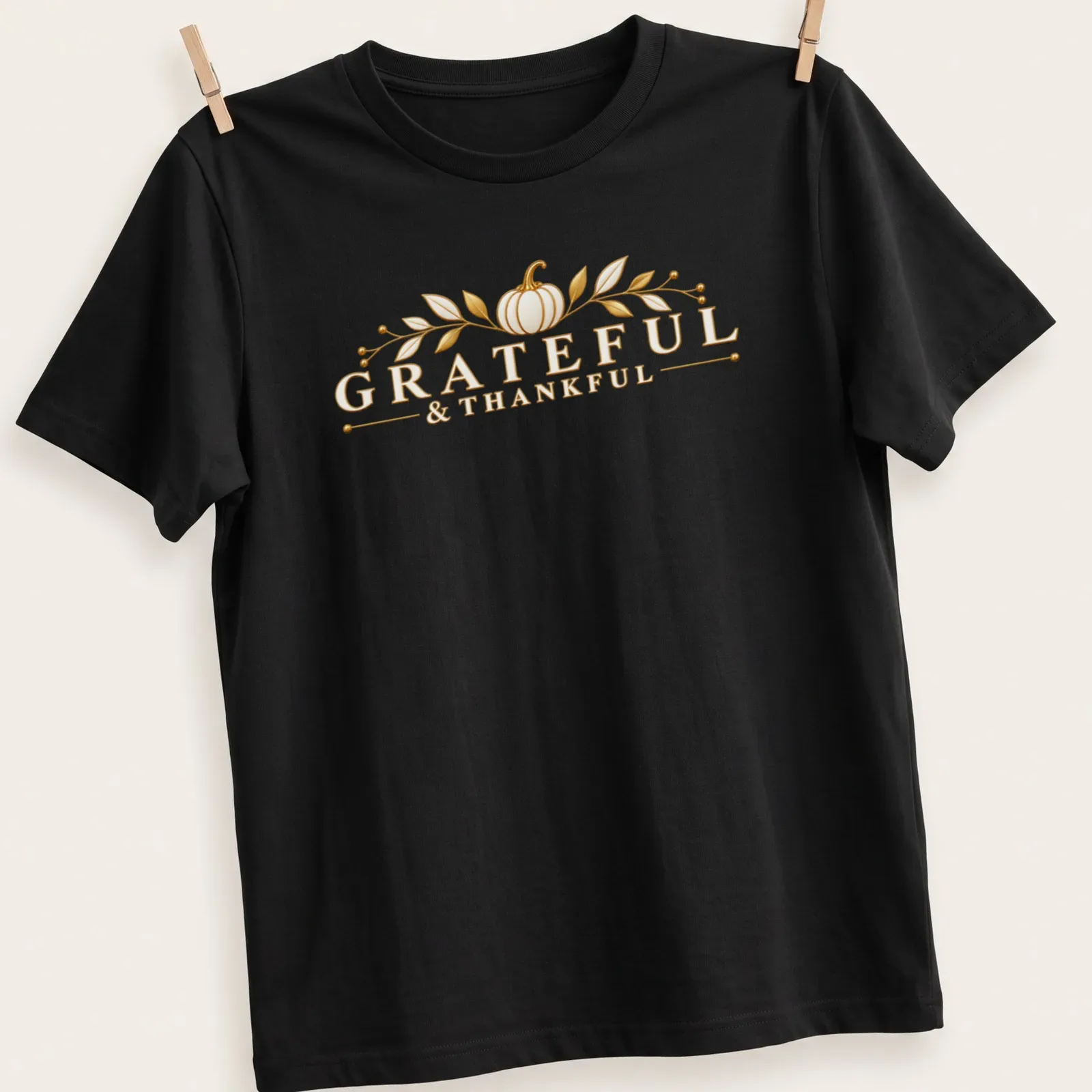 Elegant golden pumpkin T-shirt with Grateful & Thankful lettering — printed on a unisex t-shirt