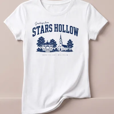 Navy and white vintage style t-shirt featuring a church and gazebo from Stars Hollow — printed on a women's shirt