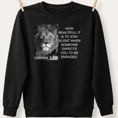 Black and white lion photo with text about silence and restraint — printed on a unisex sweatshirt