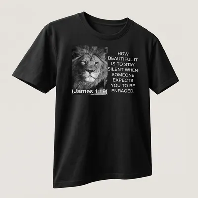 Black and white lion photo with text about silence and restraint — printed on a unisex t-shirt (angled view)