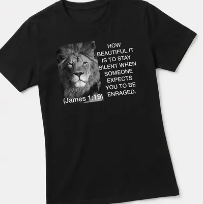 Black and white lion photo with text about silence and restraint — printed on a women's shirt