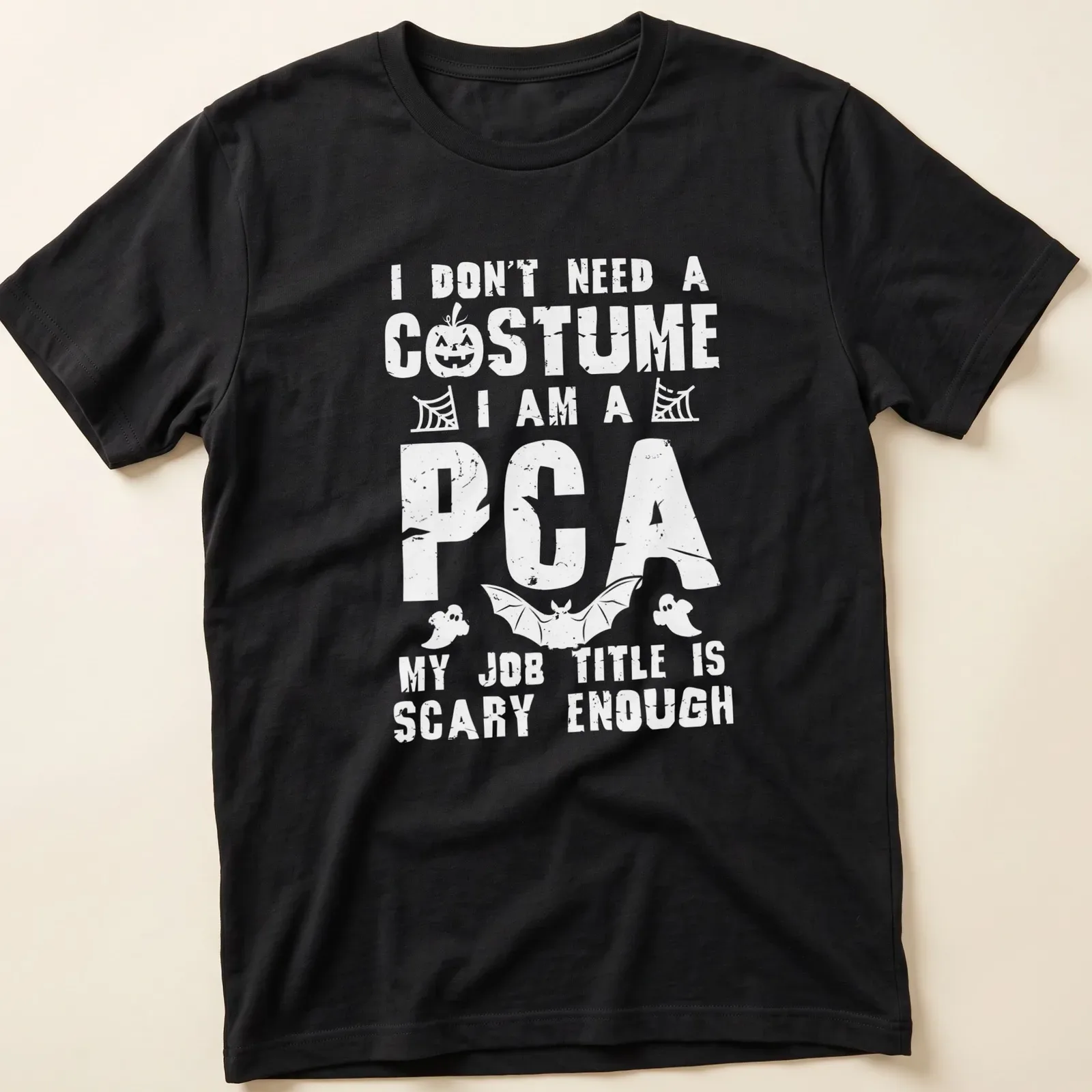 Funny Halloween t-shirt with bold text I Don't Need A Costume I Am A PCA — printed on a unisex t-shirt