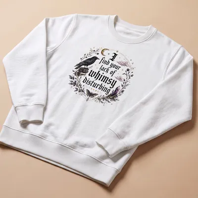 Gothic t-shirt featuring a crow and crystals with the phrase about whimsy — printed on a unisex sweatshirt