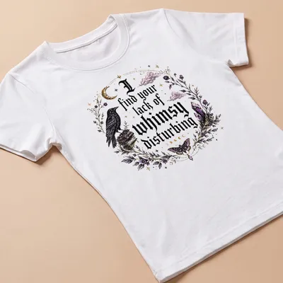 Gothic t-shirt featuring a crow and crystals with the phrase about whimsy — printed on a women's shirt