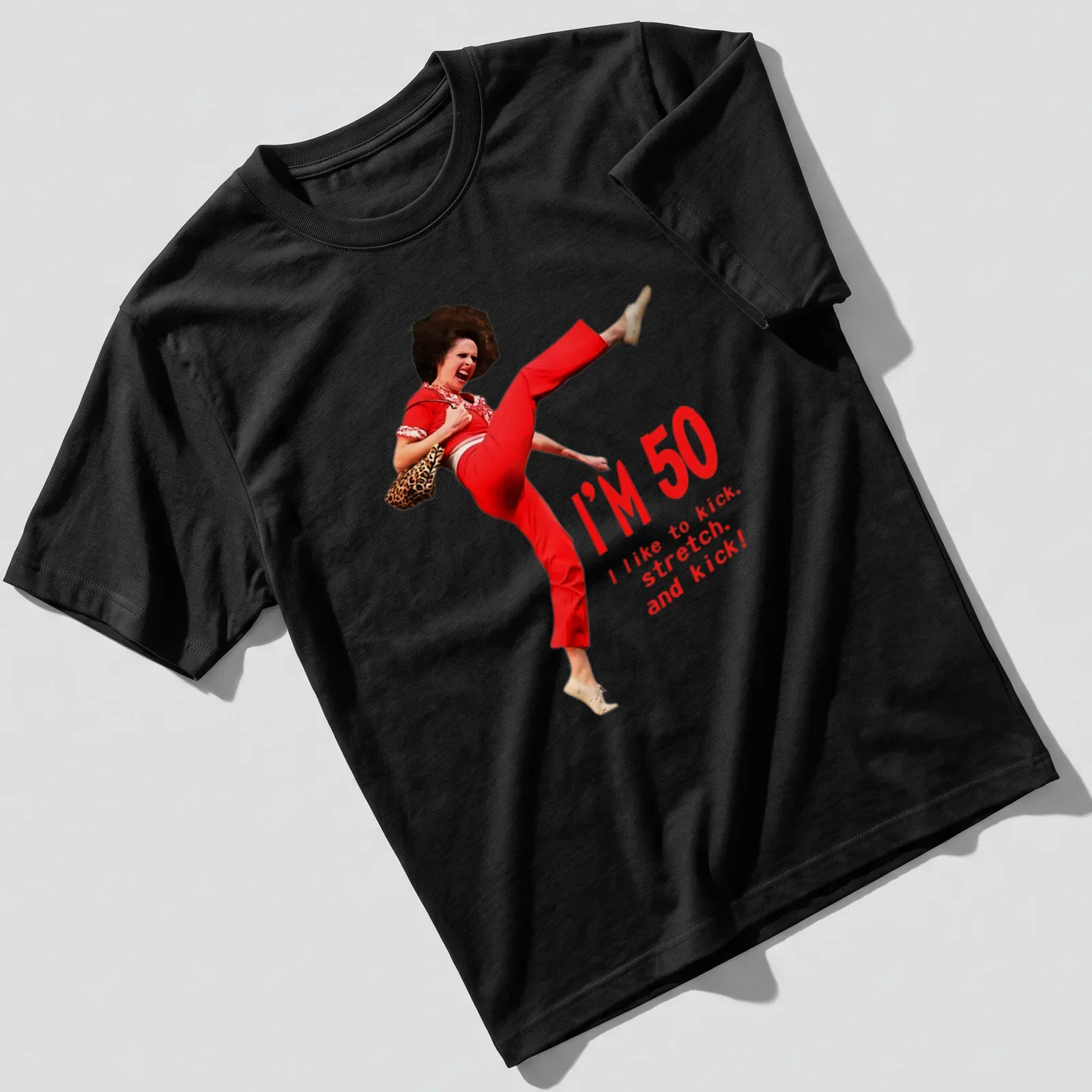 Funny 50th birthday T-shirt featuring a character kicking with humorous text — printed on a unisex t-shirt
