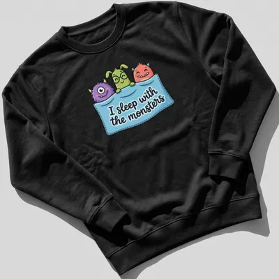 Kawaii cartoon monsters with the phrase I sleep with the monsters in bright colors. — printed on a unisex sweatshirt