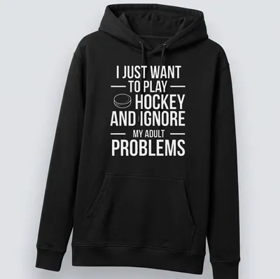 Bold typography T-shirt with the phrase about ignoring adult problems and playing ice hockey — printed on a unisex hoodie