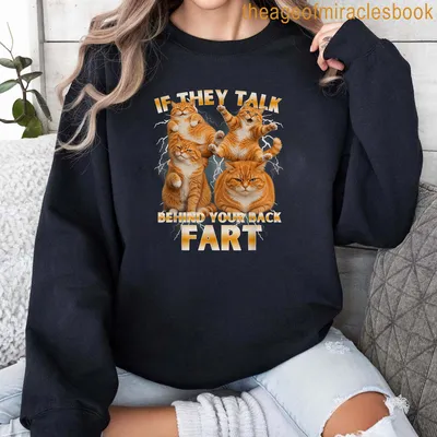 Humorous cat-themed t-shirt featuring an orange cat and a funny saying. — printed on a sweatshirt