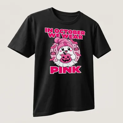 Kawaii ghost holding a pumpkin with the text 'In October We Wear Pink' — printed on a unisex t-shirt (angled view)