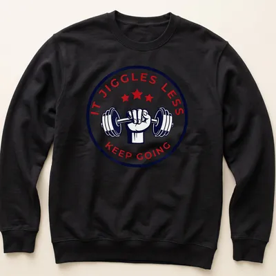 Bold fitness tee with motivational text and dumbbell graphic in red, navy, and white — printed on a unisex sweatshirt