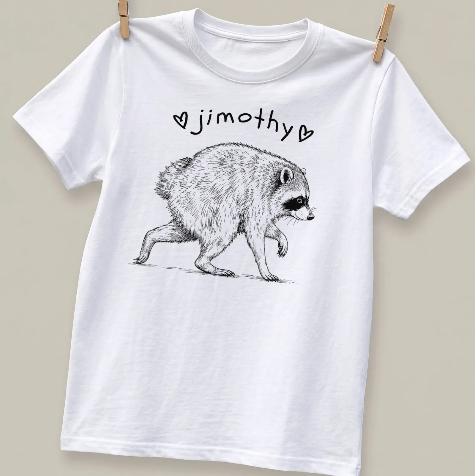 Line-art of a cute short spined raccoon with the name 'jimothy' in black and white — printed on a unisex t-shirt