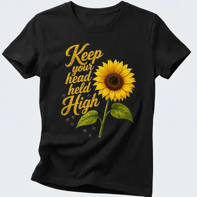 Floral t-shirt with a detailed sunflower and inspiring text in vibrant colors — printed on a women's shirt