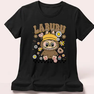 Kawaii illustration of a cute groovy monster with cupcakes and flowers, featuring the text LABUBU — printed on a women's shirt
