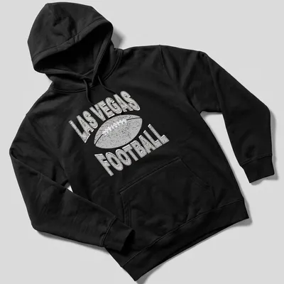 Retro distressed Las Vegas Football t-shirt with bold text and a football graphic — printed on a unisex hoodie
