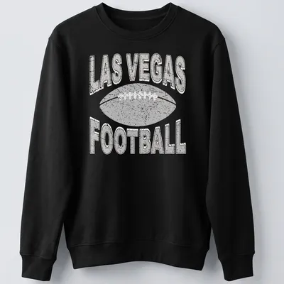 Retro distressed Las Vegas Football t-shirt with bold text and a football graphic — printed on a unisex sweatshirt