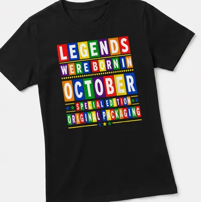 Colorful birthday-themed t-shirt with block letters celebrating October birthdays — printed on a women's shirt
