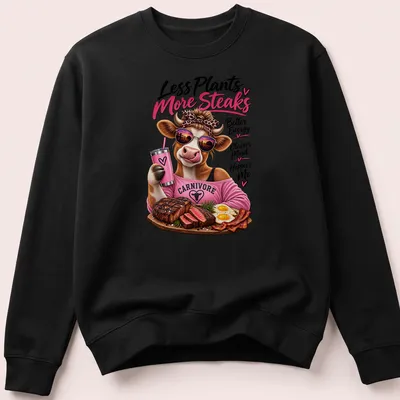Colorful cartoon cow eating steak with humorous text about energy and happiness. — printed on a unisex sweatshirt