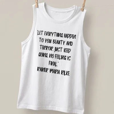 Inspirational quote by Rainer Maria Rilke in handwritten script on a white — printed on a tank top