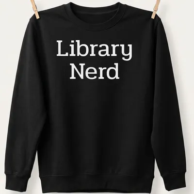 Bold typography T-shirt with 'Library Nerd' text in white — printed on a unisex sweatshirt