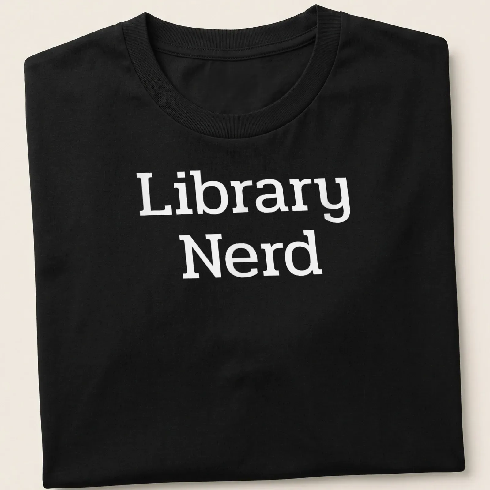 Bold typography T-shirt with 'Library Nerd' text in white — printed on a unisex t-shirt
