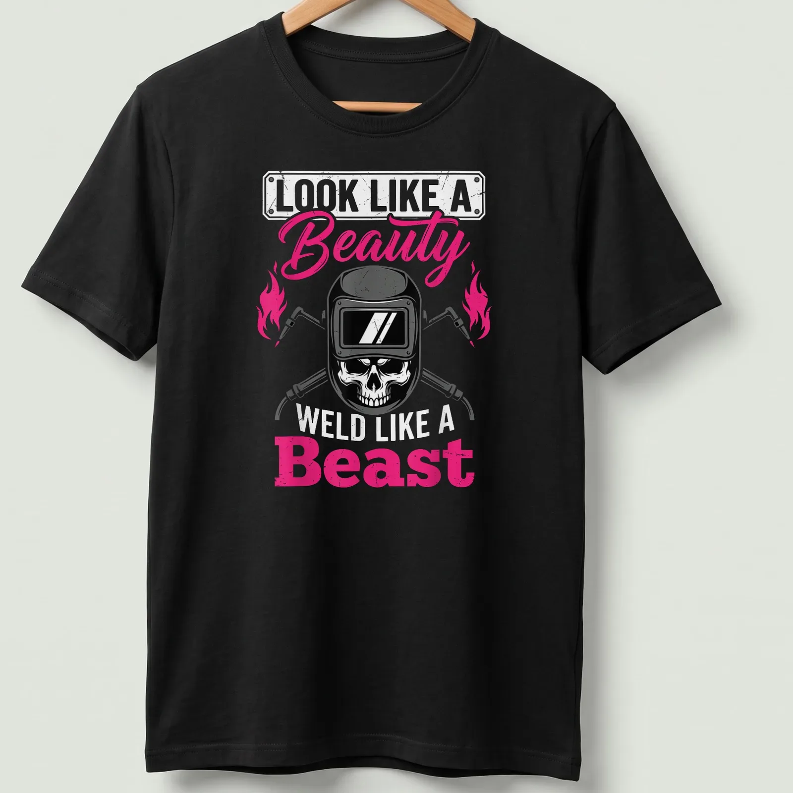Bold graphic shirt featuring a skull and the text about beauty and welding — printed on a unisex t-shirt