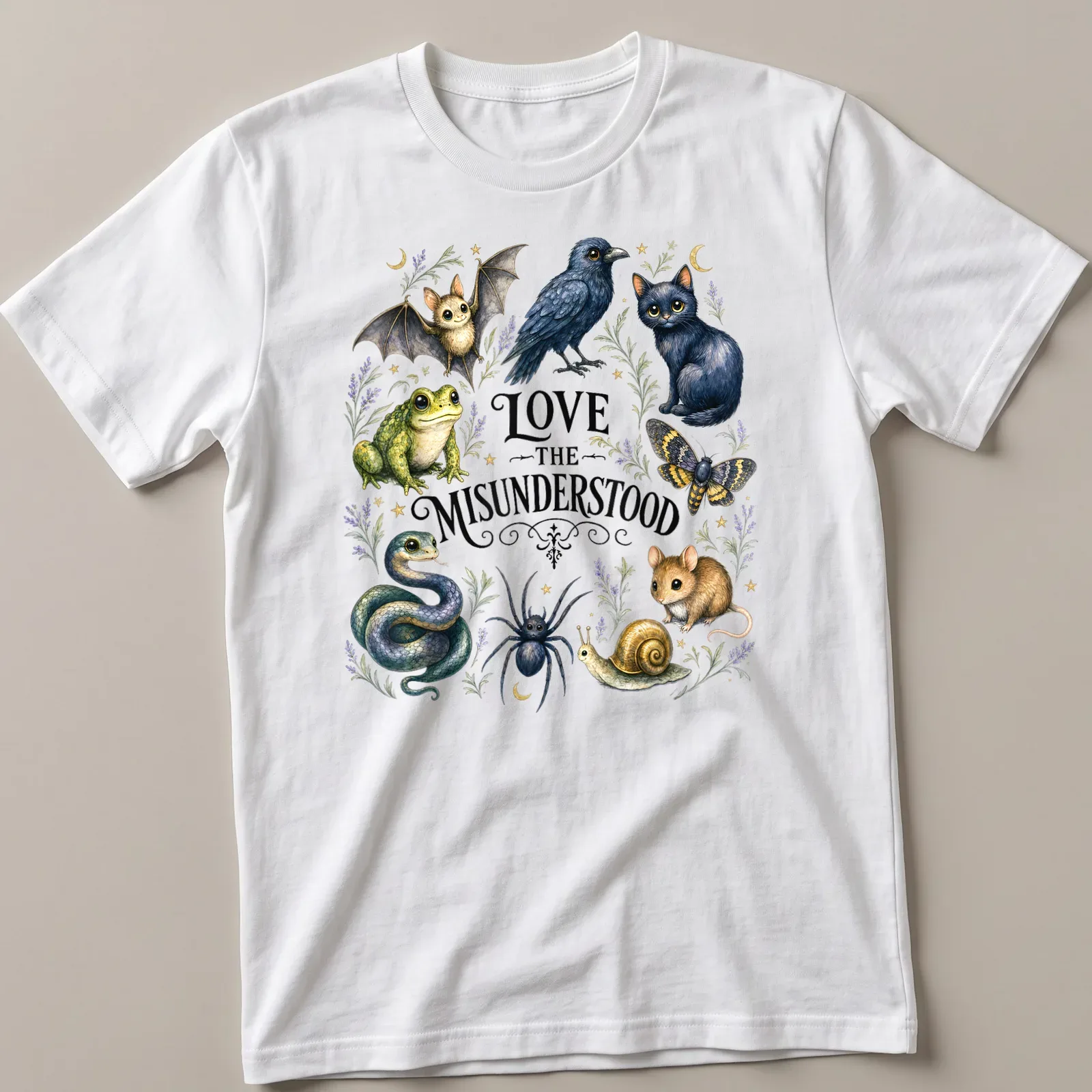 Illustration of a bat, frog, raven, cat, moth, spider, and snake with the text Love The Misunderstood — printed on a unisex t-shirt
