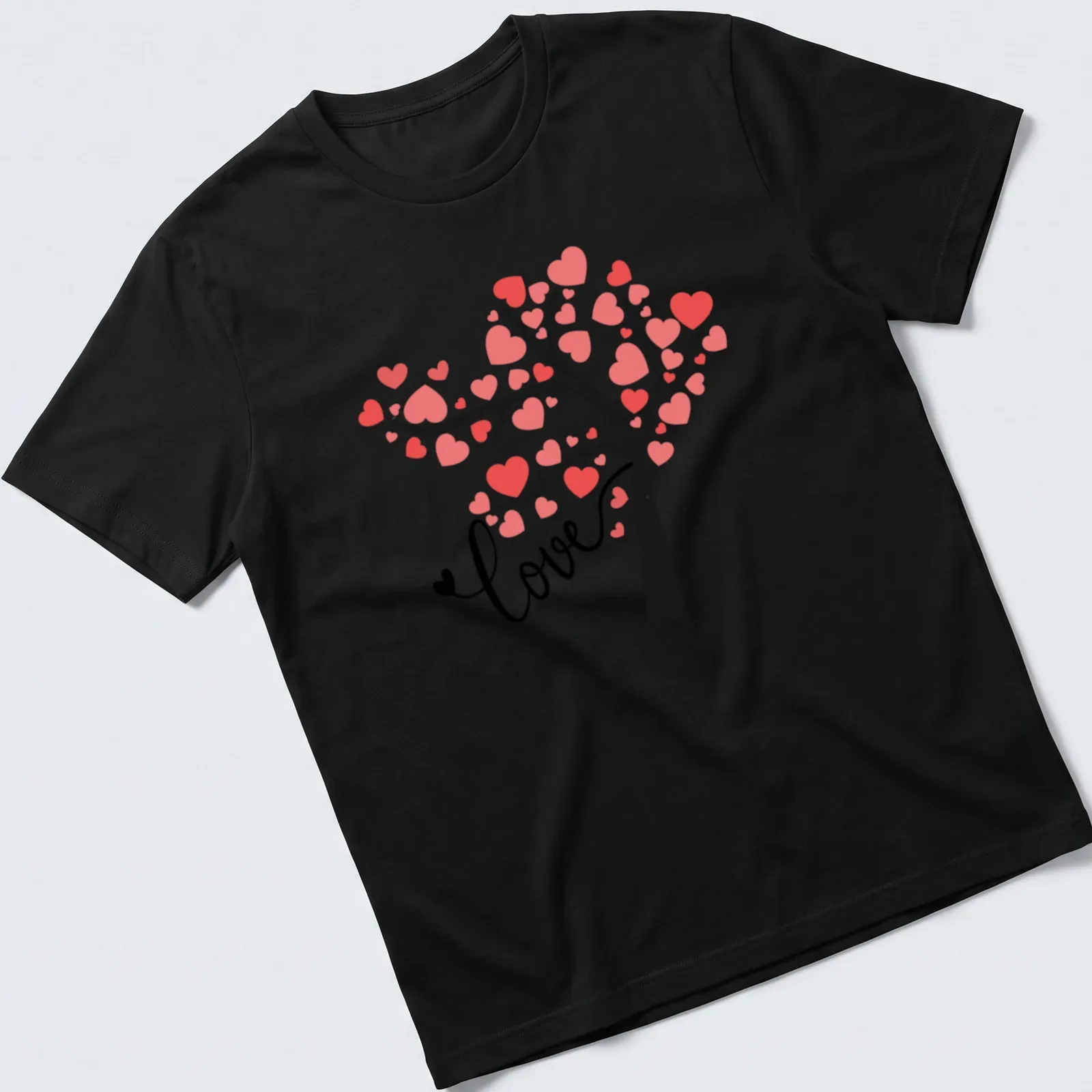 Modern illustrated T-shirt with a tree and colorful hearts spelling love — printed on a unisex t-shirt