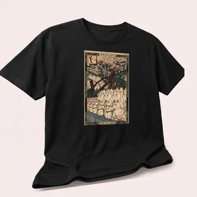 Japanese woodblock print of Lucky Cats with 招き猫図 text above — printed on a unisex t-shirt (angled view)