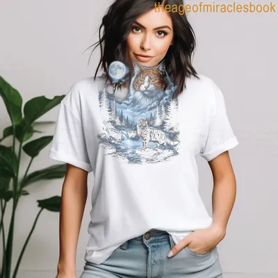 Realistic Maine Coon cat gazing at a full moon in shades of blue, white, and gray. — printed on a women's t-shirt