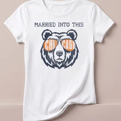 Vintage distressed tee featuring a bear in sunglasses and the phrase Married Into This Chicago — printed on a women's shirt