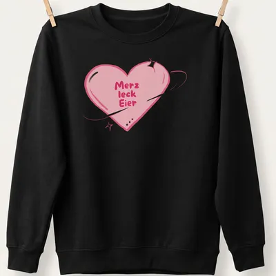 Kawaii style shirt with a heart and playful text 'Merz leck Eier' in pink and purple — printed on a unisex sweatshirt