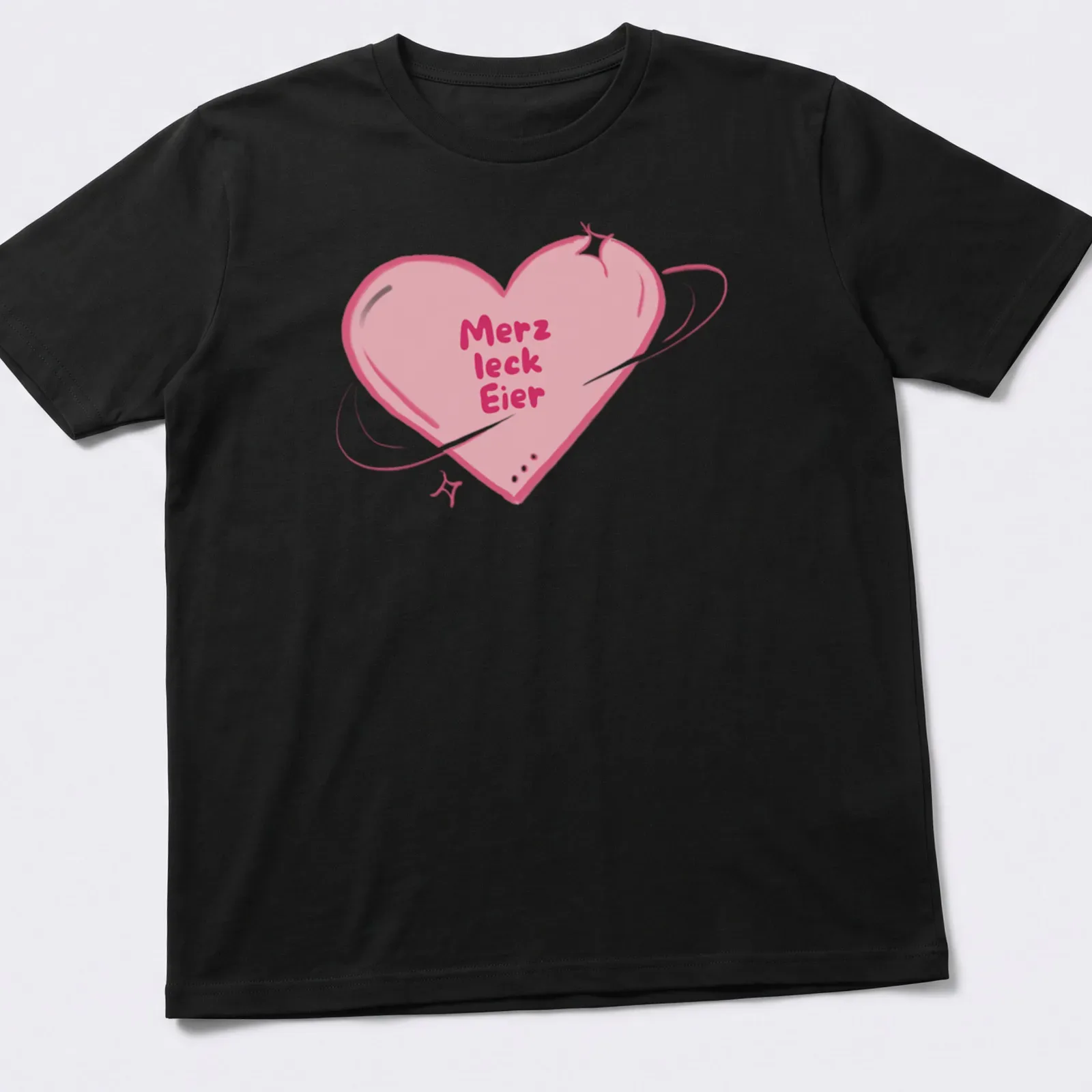Kawaii style shirt with a heart and playful text 'Merz leck Eier' in pink and purple — printed on a unisex t-shirt